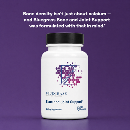 White supplement bottle with black cap on a purple background, featuring Bluegrass Bone and Joint Support text.