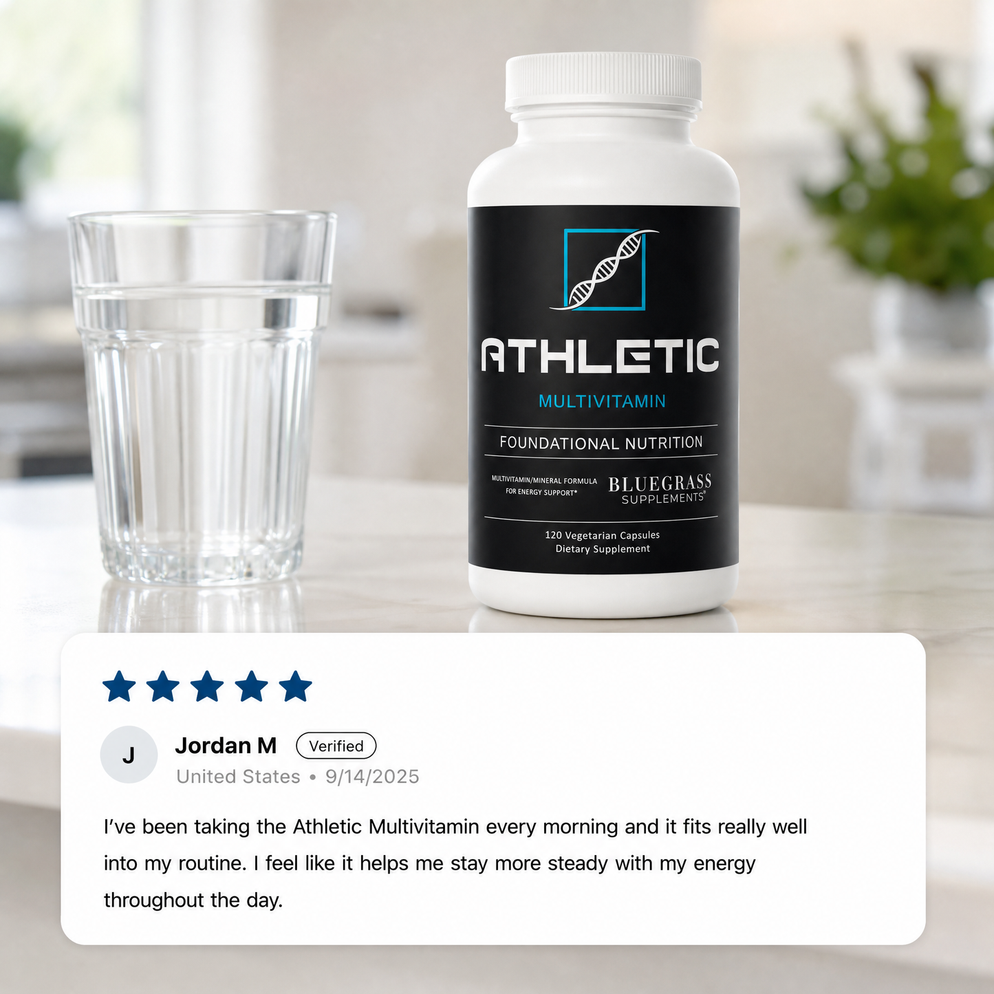 Athletic Multivitamin bottle with a glass of water on a blurred background