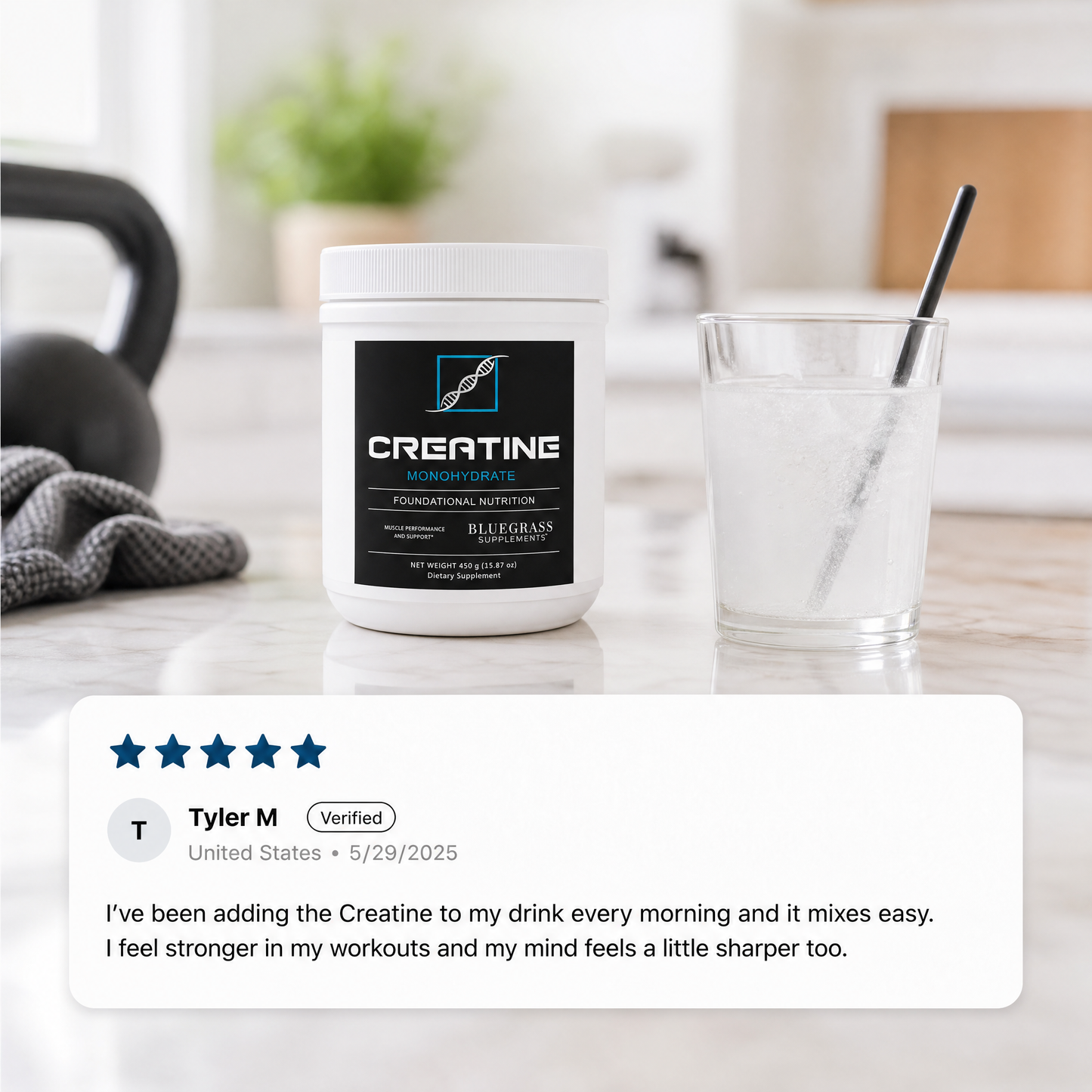 Creatine supplement container on a kitchen counter with a glass of water and a kettlebell in the background.