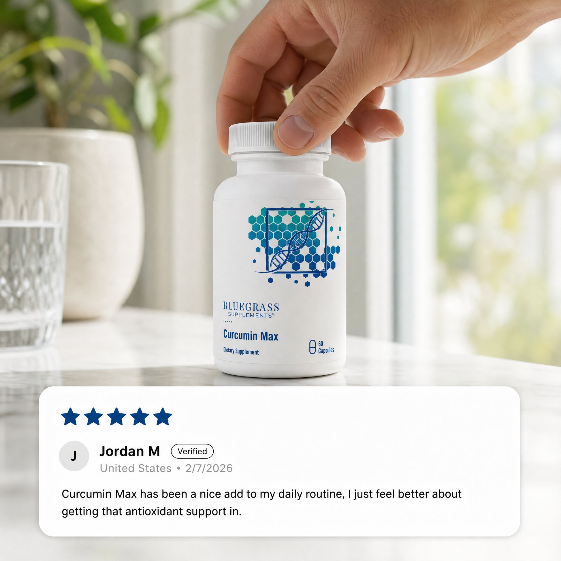 Hand holding a bottle of Bluegrass Supplements Curcumin Max beside a customer review praising its antioxidant support