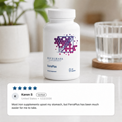 Supplement bottle labeled 'FerraPlus' by Bluegrass Supplements on a table with a customer review displayed.