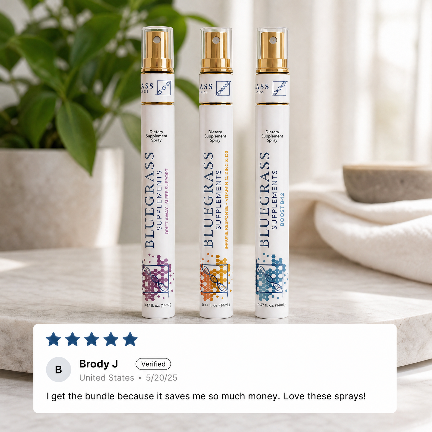 Three Bluegrass Supplements wellness sprays displayed on a countertop beside a five-star customer review.