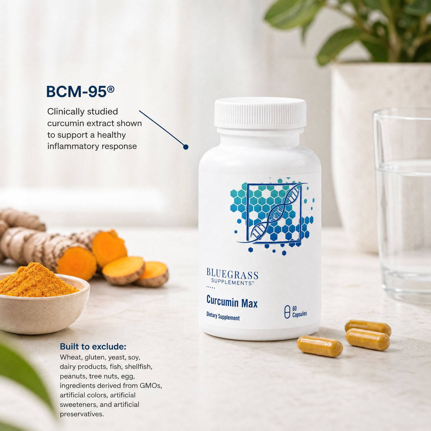 Bluegrass Supplements Curcumin Max dietary supplement bottle with turmeric and a glass of water on a light surface.