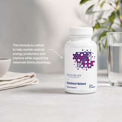 Supplement bottle labeled 'Emotional Balance' by Bluegrass Supplements on a table with text about supplement benefits.