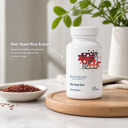 Bluegrass Supplements Red Yeast Rice Extract bottle on a wooden tray with text about cholesterol support.
