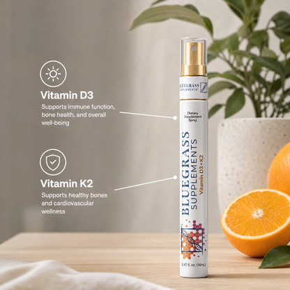 Bluegrass Supplements vitamin spray with oranges on a wooden surface