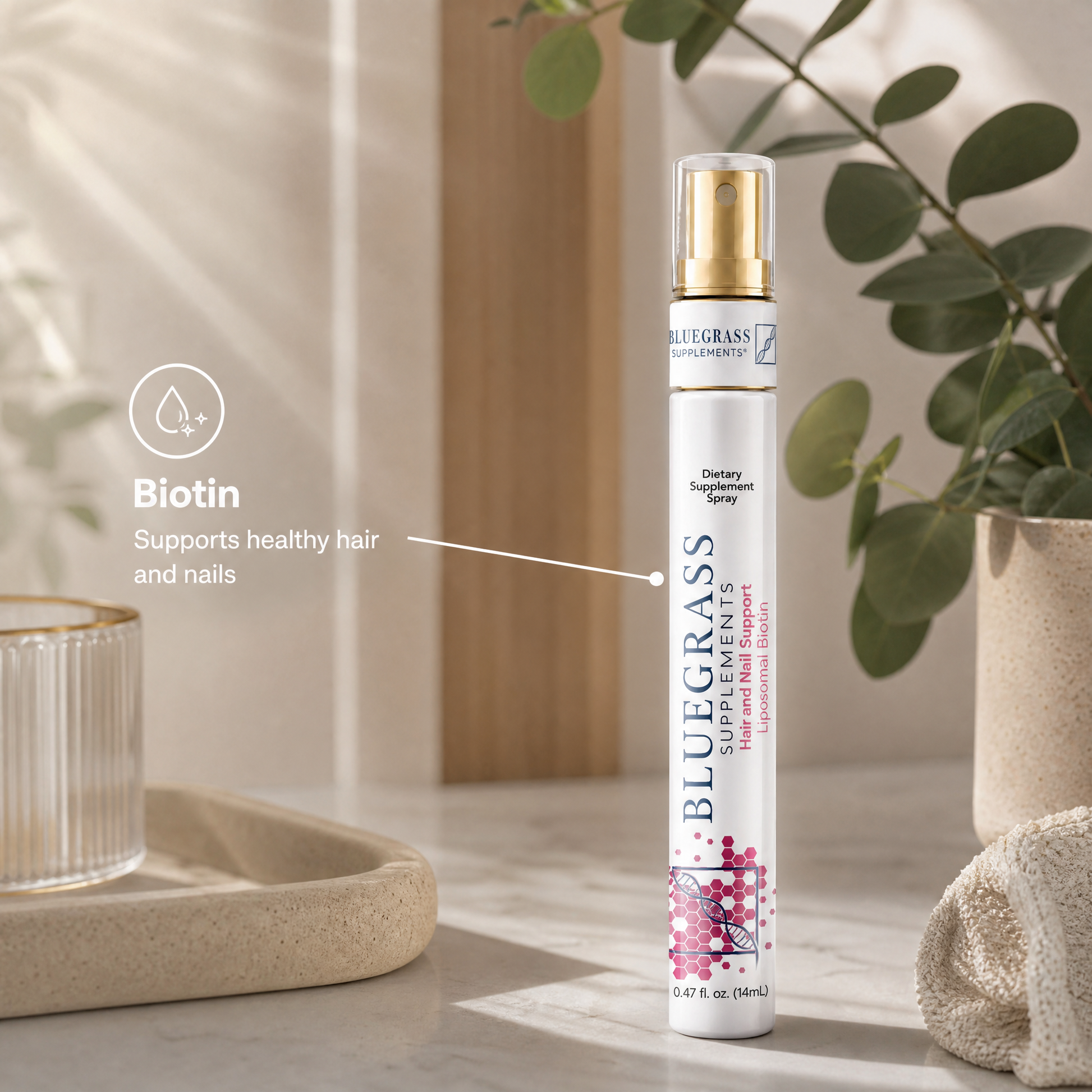 Bluegrass Hair and Nail Spray on a neutral background with decorative elements.