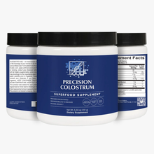 Three containers of Precision Colostrum supplement on a white background.