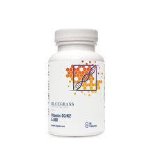 A bottle of Bluegrass Vitamin D3/K2 5000 supplements with a label featuring a DNA double helix.